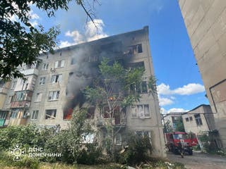 Emergency services work to extinguish a fire following a Russian attack in Donetsk region